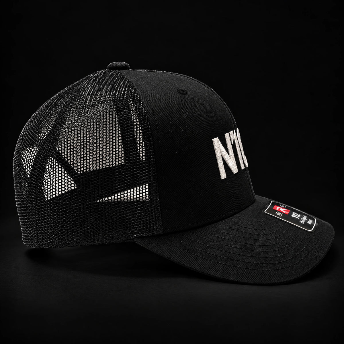 N1CE The Signature Trucker Cap in black, side view with mesh back
