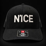 N1CE The Signature Trucker Cap in black, front view with embroidered N1CE logo